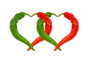 Image showing Red and green chili peppers in love. Hearts composed of hot pepp