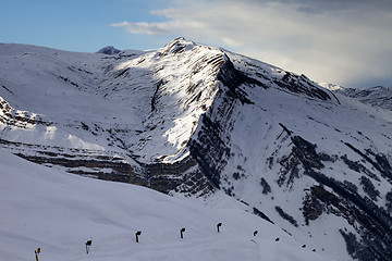 Image showing Ski slope with snow cannon at evening