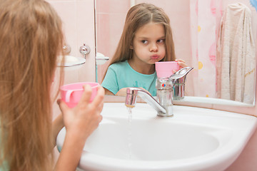 Image showing Girl rinse your mouth after brushing