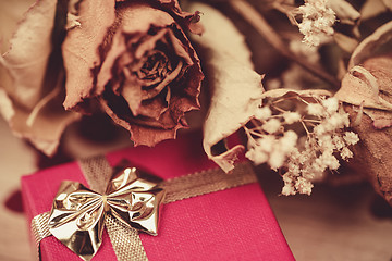 Image showing bouquet of dried roses and red box, valentine