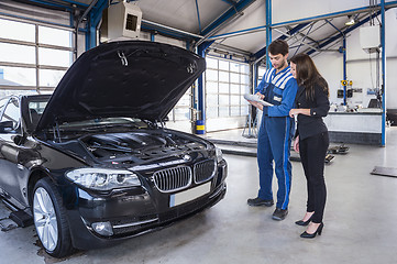 Image showing Car mechanic and customer 