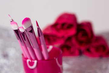 Image showing close-up pink professional cosmetic brush 