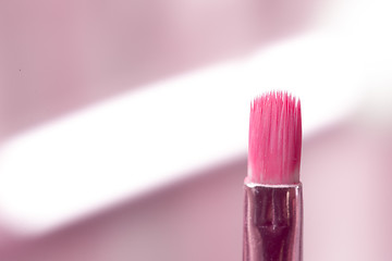 Image showing close-up pink professional cosmetic brush 