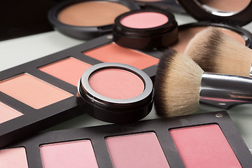 Image showing makeup cosmetics. compact powder, mineral foundation and makeup brushes