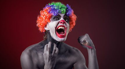 Image showing crazy clown  with a knife