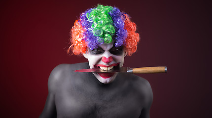 Image showing crazy clown  with a knife