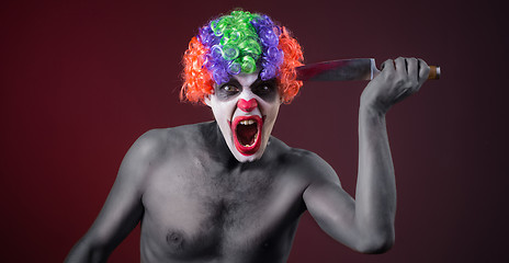 Image showing crazy clown  with a knife