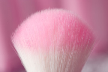 Image showing close-up pink professional cosmetic brush 