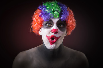 Image showing Evil Spooky Clown Portrait on dark background. expressive man