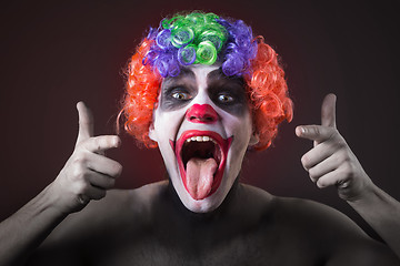 Image showing Evil Spooky Clown Portrait on dark background. expressive man