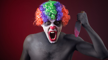 Image showing crazy clown  with a knife