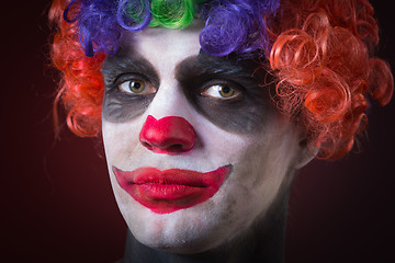 Image showing Evil Spooky Clown Portrait on dark background. expressive man