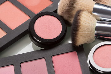 Image showing makeup cosmetics. compact powder, mineral foundation and makeup brushes