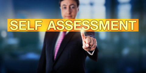 Image showing Happy Manager Pressing SELF ASSESSMENT