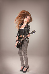 Image showing Beautiful girl playing guitar