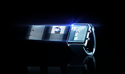 Image showing close up of black smart watch with web page