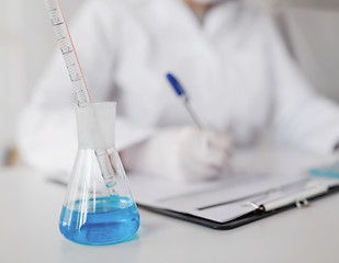 Image showing close up of scientist making test in laboratory