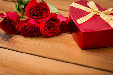 Image showing close up of heart shaped gift box and red roses