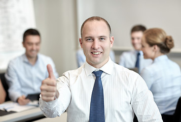 Image showing group of smiling businesspeople meeting in office