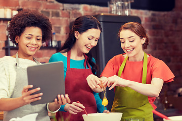 Image showing happy women with tablet pc in kitchen