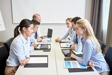 Image showing smiling business people having conflict in office