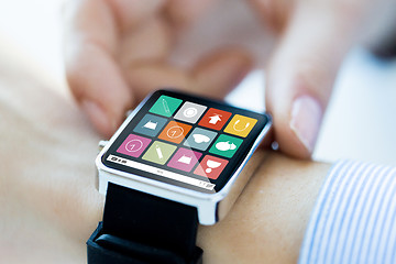 Image showing close up of hands setting smart watch application