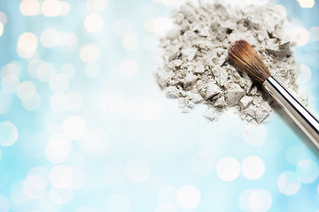 Image showing close up of makeup brush and eyeshadow over lights