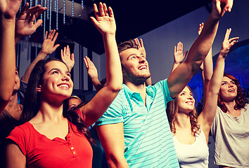 Image showing smiling friends at concert in club