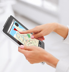 Image showing close up of hands with navigator map on tablet pc