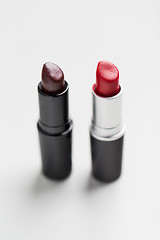 Image showing close up of two open lipsticks