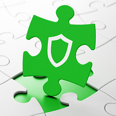 Image showing Privacy concept: Contoured Shield on puzzle background