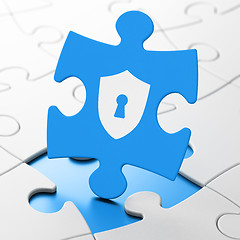 Image showing Privacy concept: Shield With Keyhole on puzzle background