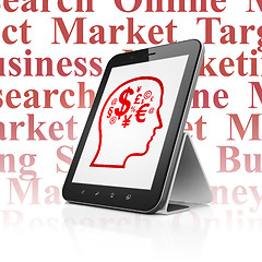 Image showing Marketing concept: Tablet Computer with Head With Finance Symbol on display