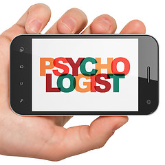 Image showing Medicine concept: Hand Holding Smartphone with Psychologist on  display