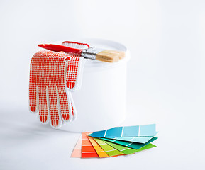 Image showing paintbrush, paint pot, gloves and pantone samplers