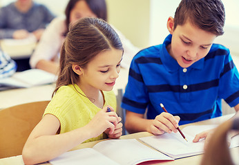 Image showing group of school kids writing test in classroom