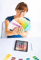 Image showing woman showing pantone color samples