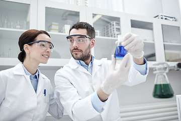 Image showing young scientists making test or research in lab