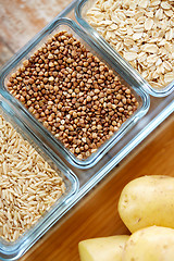 Image showing close up of grain in glass bowls on wooden table