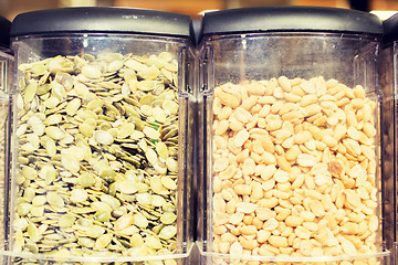 Image showing jars of peanuts and pumpkin seeds at grocery store