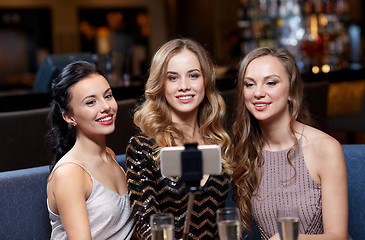 Image showing women with smartphone taking selfie at night club