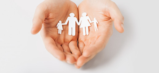 Image showing man hands with paper man family
