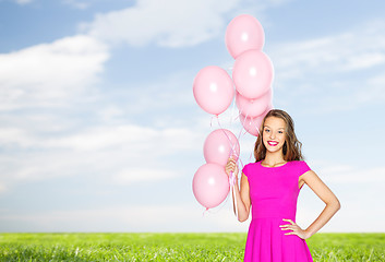Image showing happy young woman or teen with helium air balloons