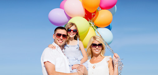 Image showing family with colorful balloons