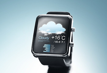 Image showing close up of black smart watch with weather app