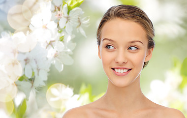 Image showing smiling young woman face and shoulders