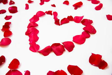 Image showing close up of red rose petals in heart shape