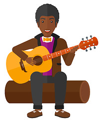 Image showing Man playing guitar.