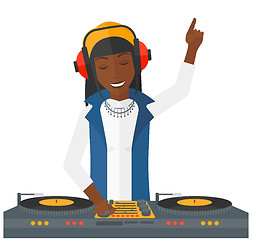 Image showing Smiling DJ with console.