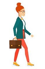 Image showing Business woman walking with briefcase. 